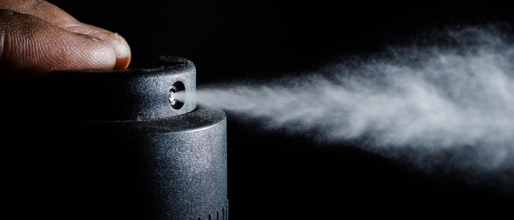 Tiny drops of spray frozen in expansion.