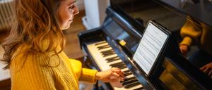 Ob Pianistin oder Streichquartett: Immer mehr Musiker spielen von Tablets statt von Papiernoten. 