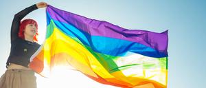 Young girl raising LGBT flag in street in daylight Madrid, Community of Madrid, Spain PUBLICATIONxINxGERxSUIxAUTxONLY CR_ADRO200828-468350-01 ,model released, Symbolfoto ,property released 
QueerYouth