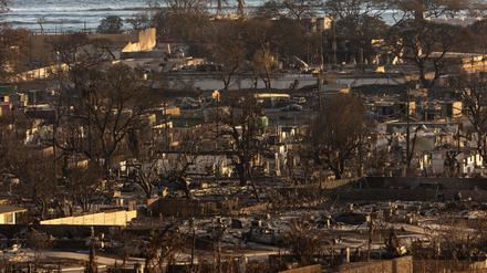 TOPSHOT - Burned houses and buildings are pictured in the aftermath of a wildfire, is seen in Lahaina, western Maui, Hawaii on August 12, 2023. Hawaii's Attorney General, Anne Lopez, said August 11, she was opening a probe into the handling of devastating wildfires that killed at least 80 people in the state this week, as criticism grows of the official response. The announcement and increased death toll came as residents of Lahaina were allowed back into the town for the first time. (Photo by Yuki IWAMURA / AFP)