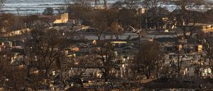 TOPSHOT - Burned houses and buildings are pictured in the aftermath of a wildfire, is seen in Lahaina, western Maui, Hawaii on August 12, 2023. Hawaii's Attorney General, Anne Lopez, said August 11, she was opening a probe into the handling of devastating wildfires that killed at least 80 people in the state this week, as criticism grows of the official response. The announcement and increased death toll came as residents of Lahaina were allowed back into the town for the first time. (Photo by Yuki IWAMURA / AFP)