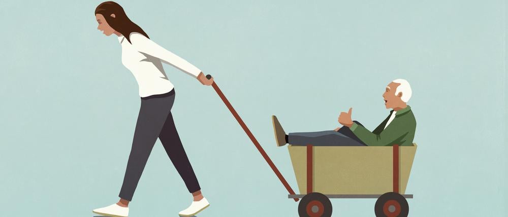 Woman pulling senior grandfather in wagon
