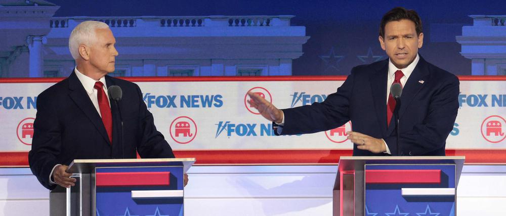 Mike Pence (l.) und Ron DeSantis