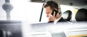 businessman on the phone in the taxi