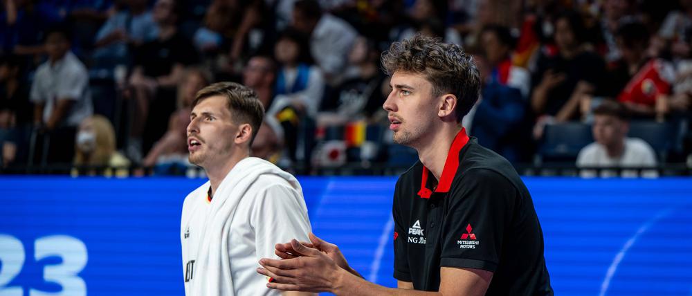 David Krämer (l.) ist der einzige Weltmeister im Team von Bundestrainer Gordon Herbert, der u. a. auf NBA-Profi Franz Wagner verzichten muss.