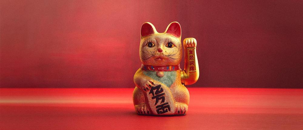 Eine Maneki Neko, asiatische Winkekatze.