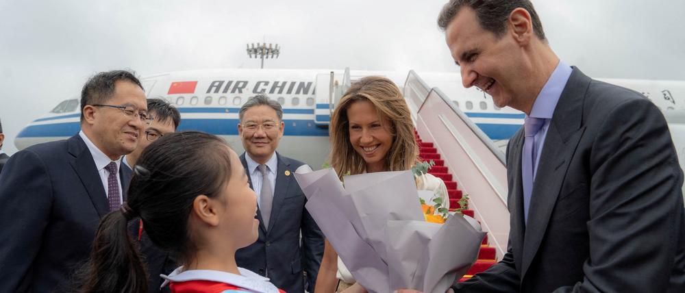 Willkommen in Hangzou. Syriens Präsident Bashar al-Assad und seine Frau Asma. Assad war lange Zeit politisch stark isoliert, nachdem seine Regierung gegen Proteste 2011 und im darauffolgenden Bürgerkrieg mit äußerster Härte gegen die syrische Bevölkerung vorgegangen war.