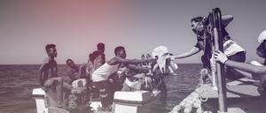 Migranten vor der Küste Libyens erhalten Hilfe durch die Besatzung eines Seenotrettungsschiffes. 
