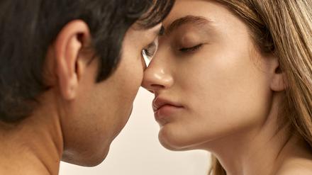 back-view-shirtless-man-side-view-woman-almost-kissin