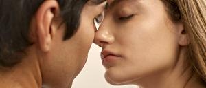 back-view-shirtless-man-side-view-woman-almost-kissin
