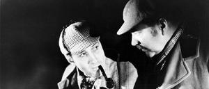 Mit Pfeife im Mund lösen Detektiv Sherlock Holmes und sein Assistent Doktor Watson einen Fall.