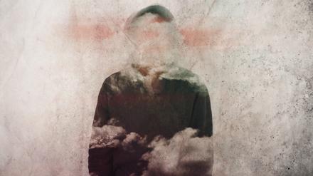 A mental health concept. Of a man with his head covered in clouds.  With a grunge, artistic edit                 