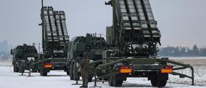 FILE PHOTO: Serviceman patrols in front of the Patriot air defence system during Polish military training on the missile systems at the airport in Warsaw, Poland February 7, 2023. REUTERS/Kacper Pempel/File Photo