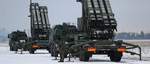 FILE PHOTO: Serviceman patrols in front of the Patriot air defence system during Polish military training on the missile systems at the airport in Warsaw, Poland February 7, 2023. REUTERS/Kacper Pempel/File Photo