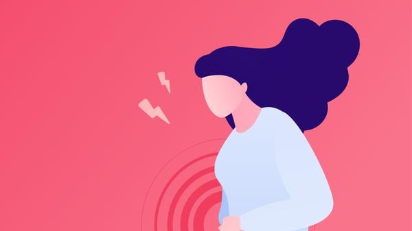 Painful female periods concept. Vector flat character illustration. Woman standing and suffering menstrual abdominal pain isolated on pink background. Design for health care.