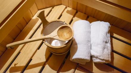 Indoor of a Finnish sauna, with a water bucket , Spa and Wellness concept in a hotel