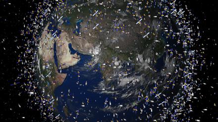 Das computergenerierte Bild der European Space Agency (ESA) zeigt Weltraummüll früherer Weltraummissionen, der neben intakten Satelliten um die Erde kreist.