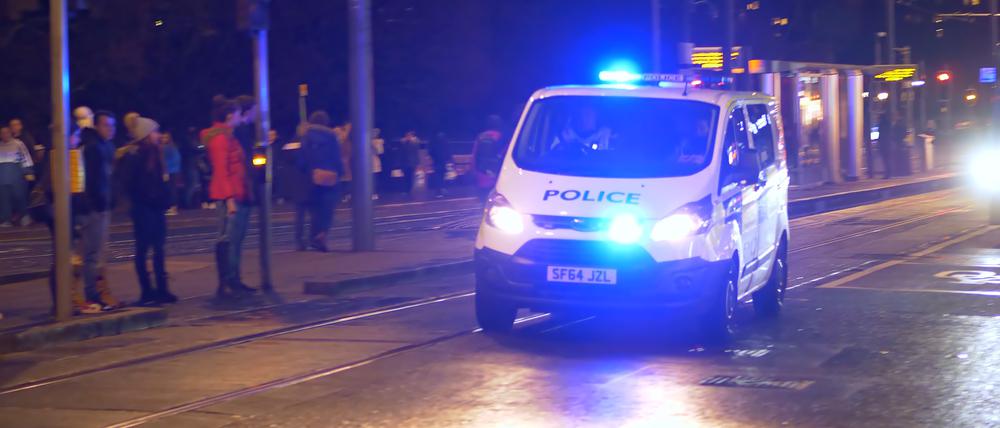 Police  Car  on  duty  in  the  city  of  Edinburgh  -  EDINBURGH,  UNITED  KINGDOM  -  JANUARY  10,  2020 xkwx edinburgh,  scotland,  city,  cityscape,  castle,  uk,  skyline,  architecture,  tourism,  europe,  landmark,  urban,  monument,  sky,  tower,  famous,  edinburgh  castle,  horizontal,  place  of  interest,  capital,  old,  street,  building  exterior,  built  structure,  dusk,  scottish,  travel  destinations,  ancient,  attraction,  popular,  horizon,  national  landmark,  travel,  outside,  history,  daytime,  outdoor,  landscape,  great  britain,  scots