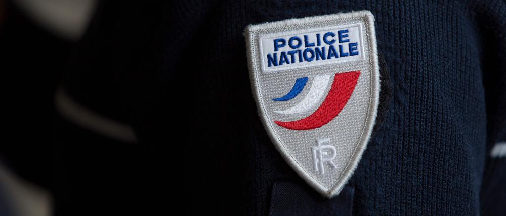 (FILES) A French police (Police Nationale) badge is pictured during the presentation of the French police (Police Nationale) new recruitment campaign, on May 4, 2016 in Paris. A 14-year-old teenager was stabbed to death on the platform of the Saint-Denis metro in the on January 17, 2024, during a brawl between several people, according to the Bobigny public prosecutor's office and police sources. The incident took place in the early evening at Basilique de Saint-Denis station on line 13 of the Paris metro, according to the same sources. The young man was seriously injured before dying, despite receiving heart massage from the fire brigade. (Photo by Geoffroy Van der Hasselt / AFP)