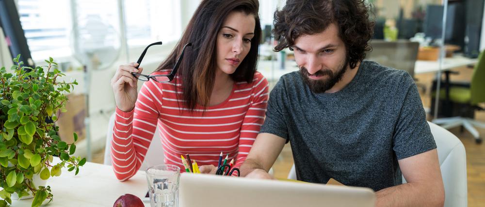 Male and female graphic designers using laptop in office
KI Job Search