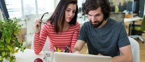 Male and female graphic designers using laptop in office
KI Job Search