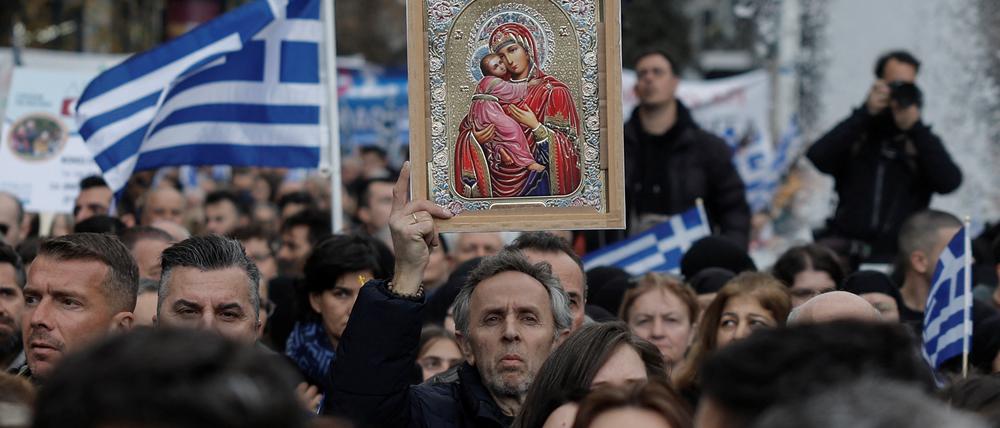 People gather to protest a bill allowing LGBT+ marriage and recognising their children, ahead of the vote in parliament in Athens, Greece, February 11, 2024. REUTERS/Louisa Gouliamaki