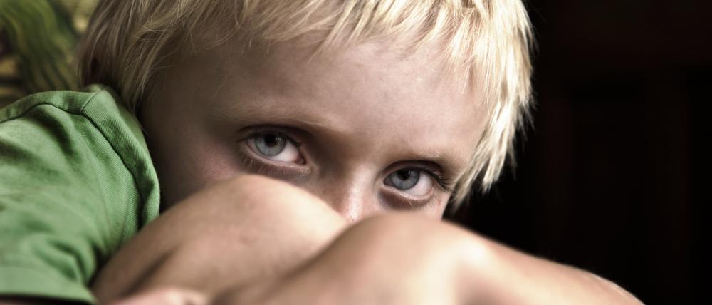 Something has scared this 7-year-old, that's clear, and left him cowering. A disturbing image, but perfect for all sorts of childhood issues. Shot with Canon EOS 1Ds Mark III.