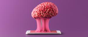 The human brain is stuck to a smartphone on a purple background. Concept of a day without gadgets.
