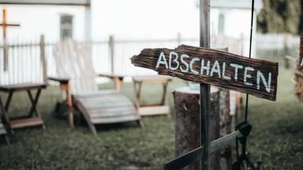 „Ausschalten“-Schild beim Handy-Detox-Seminar.