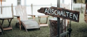 „Ausschalten“-Schild beim Handy-Detox-Seminar.