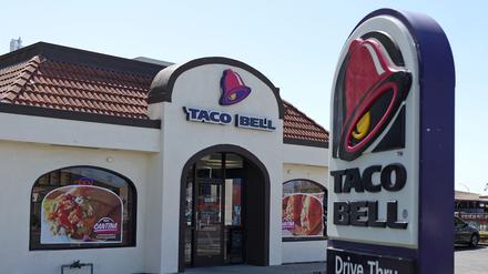 A sign is posted in front of a Taco Bell restaurant on May 01, 2024 in Richmond, California.