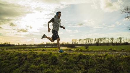 Germany, Mannheim, young man jogging