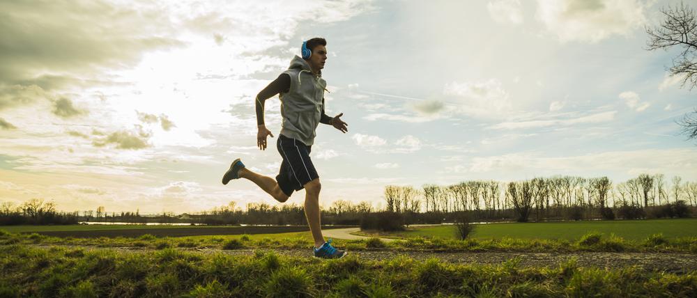 Germany, Mannheim, young man jogging
