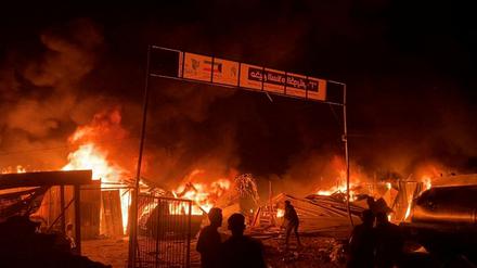 Fire rages following an Israeli strike on an area designated for displaced Palestinians, amid the ongoing conflict between Israel and Hamas, in Rafah in the southern Gaza Strip, in this still picture taken from a video, May 26, 2024. 