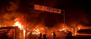 Fire rages following an Israeli strike on an area designated for displaced Palestinians, amid the ongoing conflict between Israel and Hamas, in Rafah in the southern Gaza Strip, in this still picture taken from a video, May 26, 2024. 