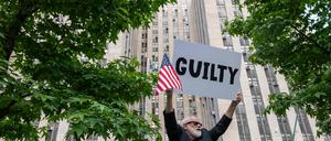 NEW YORK, NEW YORK - MAY 30: People celebrate after former President Donald Trump was found guilty on all counts at Manhattan Criminal Court on May 30, 2024 in New York City. The former president was found guilty on all 34 felony counts of falsifying business records in the first of his criminal cases to go to trial.   Spencer Platt/Getty Images/AFP (Photo by SPENCER PLATT / GETTY IMAGES NORTH AMERICA / Getty Images via AFP)