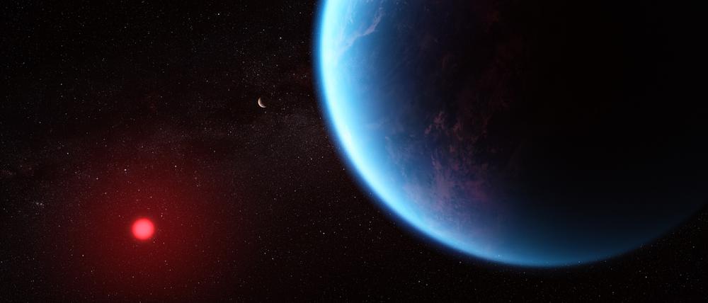 Der Exoplanet K2-18 b (blau) hat fast die zehnfache Masse der Erde und umrundet einen Zwergstern (rot) innerhalb der bewohnbaren Zone.