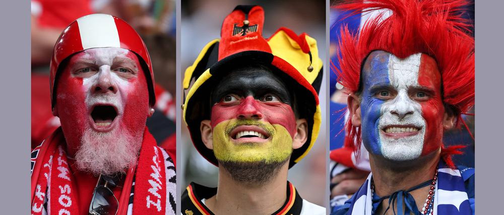 In ihren Nationalfarben geschminkte Fußballfans bei der EM 2024.
