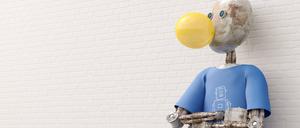Ein Roboter macht eine Kaugummiblase. Platzt die KI-Blase?