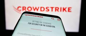 Mobile phone with website of cybersecurity company CrowdStrike Holdings Inc. on screen. Stuttgart, Germany - 03-31-2023: Mobile phone with website of cybersecurity company CrowdStrike Holdings Inc. on screen in front of logo. Focus on top-left of phone display. Copyright: xZoonar.com/TimonxSchneiderx 20112382