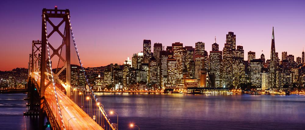 San Francisco skyline and Bay Bridge at sunset, California