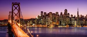 San Francisco skyline and Bay Bridge at sunset, California