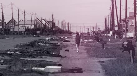FILE PHOTO: A resident walks past debris in the aftermath of Hurricane Beryl in Surfside Beach, Texas, U.S., July 8, 2024. REUTERS/Adrees Latif/File Photo