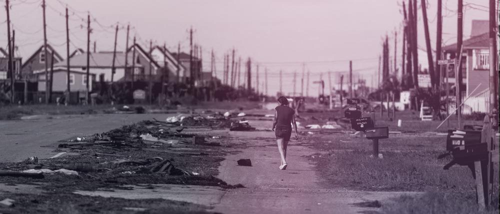 FILE PHOTO: A resident walks past debris in the aftermath of Hurricane Beryl in Surfside Beach, Texas, U.S., July 8, 2024. REUTERS/Adrees Latif/File Photo