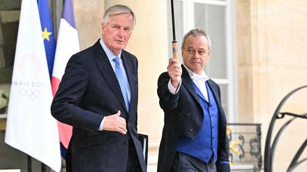 Premierminister Michel Barnier (l.) nach dem ersten Kabinettstreffen am Montag.