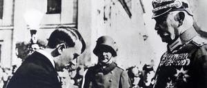 Photographic print of President Paul von Hindenburg 1847-1934 shaking hands with Adolf Hitler 1889-1945 in Poland. Dated 20th Century PUBLICATIONxINxGERxSUIxAUTxHUNxONLY