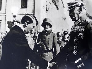 Photographic print of President Paul von Hindenburg 1847-1934 shaking hands with Adolf Hitler 1889-1945 in Poland. Dated 20th Century PUBLICATIONxINxGERxSUIxAUTxHUNxONLY