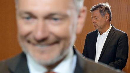 German Finance Minister Christian Lindner (L) and German Minister of Economics and Climate Protection Robert Habeck arrive for the weekly German government cabinet meeting at the Chancellery in Berlin on September 25, 2024. (Photo by Tobias SCHWARZ / AFP)