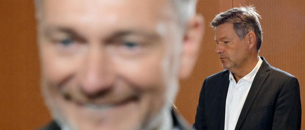 German Finance Minister Christian Lindner (L) and German Minister of Economics and Climate Protection Robert Habeck arrive for the weekly German government cabinet meeting at the Chancellery in Berlin on September 25, 2024. (Photo by Tobias SCHWARZ / AFP)