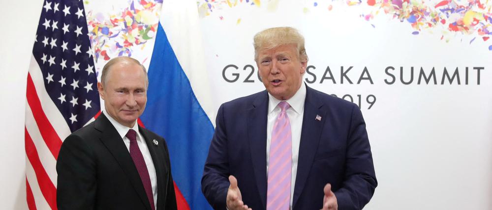 Russlands Präsident Wladimir Putin and der künftige US-Präsident Donald Trump.